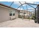 Screened patio with bench and swing, offering a tranquil outdoor living space with plenty of natural light at 5480 White Ibis Dr, North Port, FL 34287