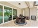 Outdoor patio featuring dining furniture, providing a perfect spot for alfresco meals with a view of the pool at 5480 White Ibis Dr, North Port, FL 34287