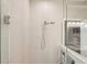 Walk-in shower with glass enclosure, tiled walls, and modern shower head at 5480 White Ibis Dr, North Port, FL 34287