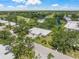 Aerial view of the property, showing the home's layout and its proximity to the golf course at 5623 Palm Aire Dr, Sarasota, FL 34243