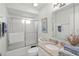 Clean and well-lit bathroom features a shower, vanity with granite countertop, and ample storage at 5623 Palm Aire Dr, Sarasota, FL 34243