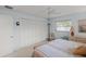 Bright bedroom with ample closet space, carpeting, and comfortable seating at 5623 Palm Aire Dr, Sarasota, FL 34243