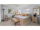 Comfortable bedroom with a cozy bed, soft lighting, and a relaxing atmosphere at 5623 Palm Aire Dr, Sarasota, FL 34243