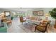 Inviting living room with neutral decor, tiled flooring, and bright windows, providing a serene atmosphere at 5623 Palm Aire Dr, Sarasota, FL 34243