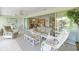 Spacious and bright Florida room with open layout and sliding glass doors to outdoor area at 5623 Palm Aire Dr, Sarasota, FL 34243