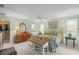 Spacious main bedroom features en-suite bathroom and large closet, along with ceiling fan and neutral carpeting at 5623 Palm Aire Dr, Sarasota, FL 34243
