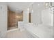 Modern bathroom featuring a glass shower, white marble countertops, and pendant lighting at 619 Key Royale Dr, Holmes Beach, FL 34217