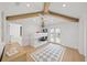 Cozy bedroom with a bunk bed, wood beams, and french doors leading to the outside at 619 Key Royale Dr, Holmes Beach, FL 34217