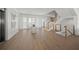 Bright foyer features wood floors, a staircase with stainless steel railing, and an elevator at 619 Key Royale Dr, Holmes Beach, FL 34217