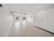 Clean and organized garage with ample storage space, epoxy flooring, and lots of natural light at 619 Key Royale Dr, Holmes Beach, FL 34217