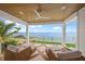 Relax on the covered patio with comfortable seating and stunning water views at 619 Key Royale Dr, Holmes Beach, FL 34217