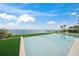 Backyard pool with a clear view of the sea at 619 Key Royale Dr, Holmes Beach, FL 34217
