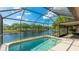 Sparkling pool with screened enclosure and canal view at 620 49Th E St, Bradenton, FL 34208
