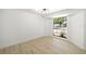 Cozy, well-lit bedroom with a large window offering natural light and neutral walls at 7158 S Leewynn Dr, Sarasota, FL 34240