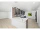Well-equipped kitchen with gray cabinetry, stainless steel appliances, and quartz countertops at 7158 S Leewynn Dr, Sarasota, FL 34240