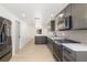 Contemporary kitchen featuring stainless steel appliances, stylish cabinets, and ample counter space at 7158 S Leewynn Dr, Sarasota, FL 34240