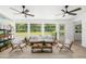 Bright living room featuring contemporary furniture, large windows, and natural light with beautiful outdoor views at 7158 S Leewynn Dr, Sarasota, FL 34240