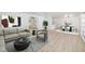 Staged living and dining area showcasing a comfortable seating arrangement and a dining table at 7158 S Leewynn Dr, Sarasota, FL 34240