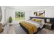 Bright main bedroom features large windows, decorative art and carpet plus a bed with yellow accents at 7158 S Leewynn Dr, Sarasota, FL 34240