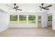 Bright sunroom with large windows offering panoramic views and allowing natural light to flood the space at 7158 S Leewynn Dr, Sarasota, FL 34240