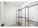 Walk-in closet features adjustable metal shelving for ample and customizable storage solutions at 7158 S Leewynn Dr, Sarasota, FL 34240