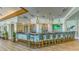 Stylish bar area featuring pendant lighting, comfortable seating, and a well-stocked display at 7319 Westminster Ct, University Park, FL 34201