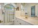 A sunny bathroom boasts a gold-trimmed shower and neutral tones at 7319 Westminster Ct, University Park, FL 34201