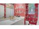 A stylish bathroom with zebra-themed wallpaper and a modern vanity at 7319 Westminster Ct, University Park, FL 34201