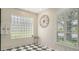 A sunny bathroom nook boasting a glass block window and black and white tile at 7319 Westminster Ct, University Park, FL 34201