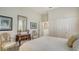 A calm bedroom featuring neutral tones, artwork and comfortable furnishings at 7319 Westminster Ct, University Park, FL 34201