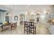 Bright and open living room with tile flooring, white trim, and an archway entry to other parts of home at 7319 Westminster Ct, University Park, FL 34201