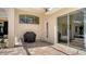 Outdoor patio featuring a grill, brick pavers, and seamless access to indoor spaces through large sliding glass doors at 7319 Westminster Ct, University Park, FL 34201
