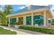 Charming pro shop exterior featuring a vibrant design, clear signage, and inviting windows showcasing golf merchandise at 7319 Westminster Ct, University Park, FL 34201