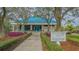 Scenic view of the tennis & fitness center, set amid lush greenery, and showcasing the tennis courts at 7319 Westminster Ct, University Park, FL 34201