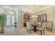 Open dining area adjacent to the kitchen with built-in bar, perfect for entertaining guests at 8263 Nice Way, Sarasota, FL 34238