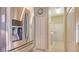 Hallway with stainless steel refrigerator, washer, and dryer at 8263 Nice Way, Sarasota, FL 34238