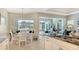Kitchen featuring granite countertops, stainless steel appliances, and adjacent dining area at 8263 Nice Way, Sarasota, FL 34238