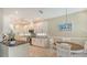 Modern kitchen featuring white cabinets, granite countertops, and stainless-steel appliances at 8263 Nice Way, Sarasota, FL 34238