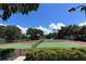 Well-maintained tennis courts with lush green surroundings at 8263 Nice Way, Sarasota, FL 34238