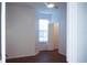 Bright bedroom with hardwood floors, a ceiling fan, and a window providing natural light and air circulation at 8325 38Th Street E Cir # 101, Sarasota, FL 34243