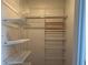 Spacious closet with shelving and rack system for organized storage, maximizing space and convenience at 8325 38Th Street E Cir # 101, Sarasota, FL 34243