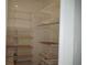 Walk-in closet featuring wire shelving and storage bins at 8325 38Th Street E Cir # 101, Sarasota, FL 34243