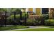 Exterior view of a black metal fence with foliage and wildlife behind it at 8325 38Th Street E Cir # 101, Sarasota, FL 34243