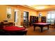 Community game room featuring a billiards table and sitting area at 8325 38Th Street E Cir # 101, Sarasota, FL 34243