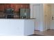 Modern kitchen with stainless steel refrigerator and wood cabinets at 8325 38Th Street E Cir # 101, Sarasota, FL 34243