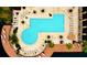 Aerial view of the outdoor pool area with tables and chairs at 8325 38Th Street E Cir # 101, Sarasota, FL 34243