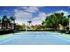 Exterior view of tennis court with trees and the buildings in the background at 8325 38Th Street E Cir # 101, Sarasota, FL 34243