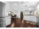 Kitchen with granite counters, stainless appliances, and an open layout to the living room at 9207 59Th Avenue E Dr, Bradenton, FL 34202