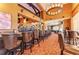 Interior view of the bar area, showcasing seating and a fully stocked bar with a chandelier at 9630 Club South Cir # 6204, Sarasota, FL 34238