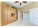 Bedroom featuring a built-in cabinet, hardwood floors, and neutral color palette at 9630 Club South Cir # 6204, Sarasota, FL 34238